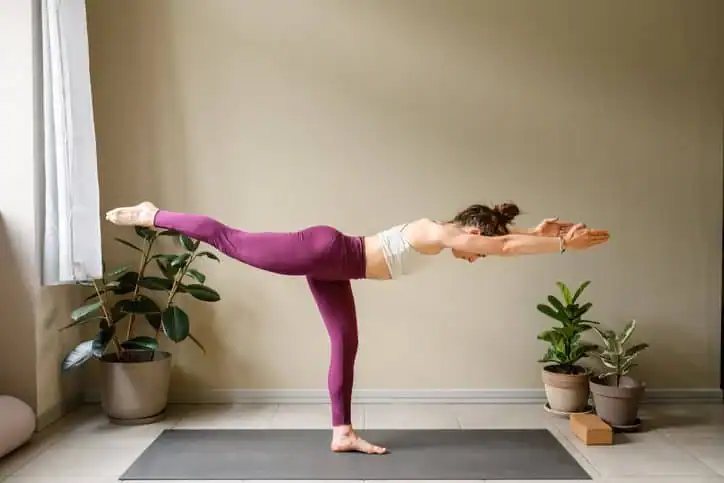 Achieving the Perfect Tone: How Often Should You Exercise for Results? 1 Woman doing Yoga exercise Guildford to help with toning the body.