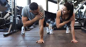 Sculpting Sleek Arms: The Essential Role of Cardio in Toning Without Bulking Up 1 Image of man and woman doing Cardio Guildford to tone their arms.